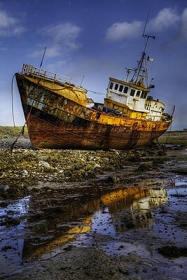 Wall Art - Photograph - Beached Fishing Trawler Reflecting while waiting for the Tide by Dennis Dame