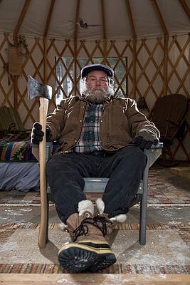 Wall Art - Photograph - Bearded Man With Ax In Sparse Yurt by Heath Korvola
