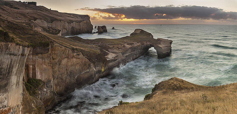 Wall Art - Photograph - Cliffs And Tunnel Beach Otago New by Colin Monteath