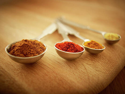 Wall Art - Photograph - Close Up Of Spices In Measuring Spoons by Adam Gault