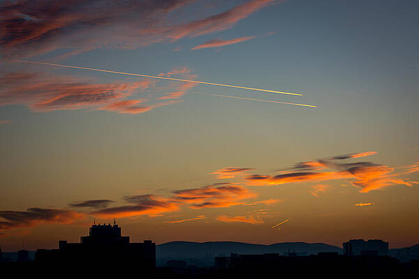 Wall Art - Photograph - Cloudy Evening Sky With Airplanes And Skyline by Andreas Berthold