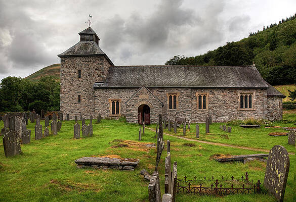 Wall Art - Photograph - Cloudy sky overshadows Melangell Church in Wales by Steven Heap
