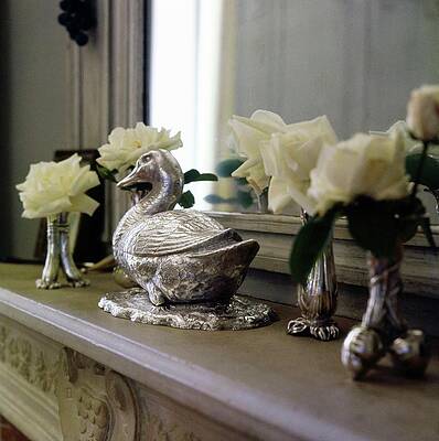 Wall Art - Photograph - Duck Ornament On A Mantelpiece by Horst P. Horst