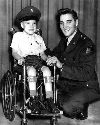 Wall Art - Photograph - Elvis Presley Takes Time With Boy by Retro Images Archive