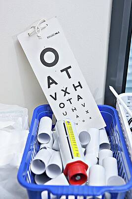 Wall Art - Photograph - Eye Chart And Lung Testing Equipment by Science Photo Library