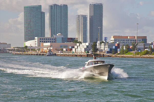 Fast-moving Pleasure Boat On City Waters Print by Barry Winiker