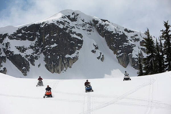 Wall Art - Photograph - Four Young Men Snowmobiling On Owlshead by Craig Pulsifer