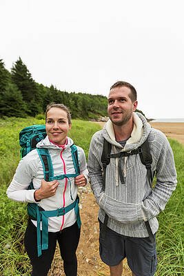 Wall Art - Photograph - Front View Of Couple Hiking On Cloudy by Jerry Monkman