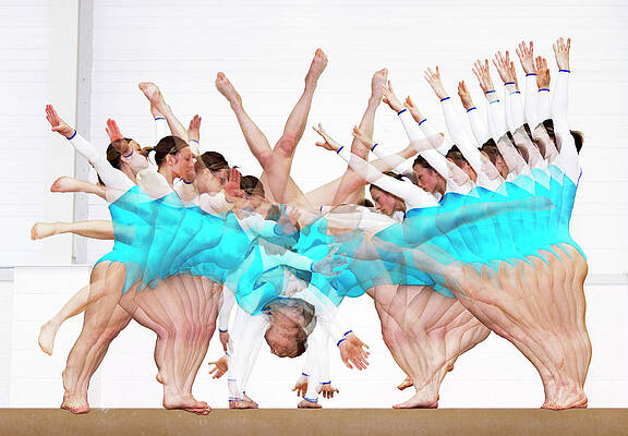 Wall Art - Photograph - Gymnast Performing A Cartwheel by Science Photo Library