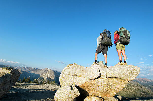 Wall Art - Photograph - Hikers Stand On Rock On Sentinel Dome by Lars Schneider