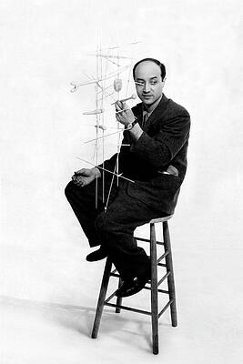 Wall Art - Photograph - Isamu Noguchi Holding One Of His Structures by Herbert Matter