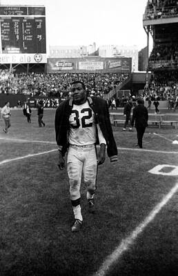 Wall Art - Photograph - Jim Brown With Coat Over Shoulder Pads by Retro Images Archive
