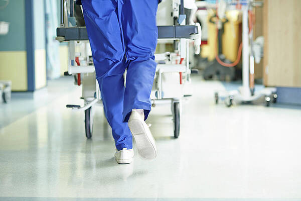 Legs Of Medic Running With Gurney Along Print by Phil Fisk