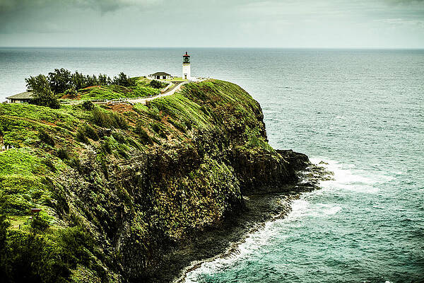 Wall Art - Photograph - Lighthouse At The Edge Of A Rock by Tim Martin