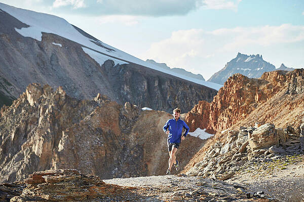 Wall Art - Photograph - Man And Women Trail Run In The San Juan by Andrew Maguire