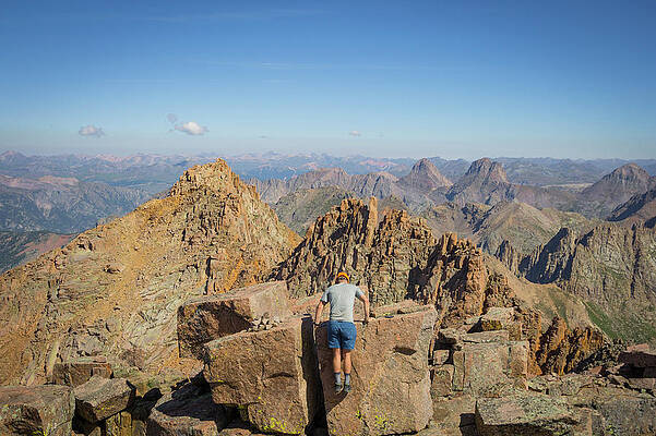 Wall Art - Photograph - Man Climbing On Top Of The Summit Rock by Taylor Reilly
