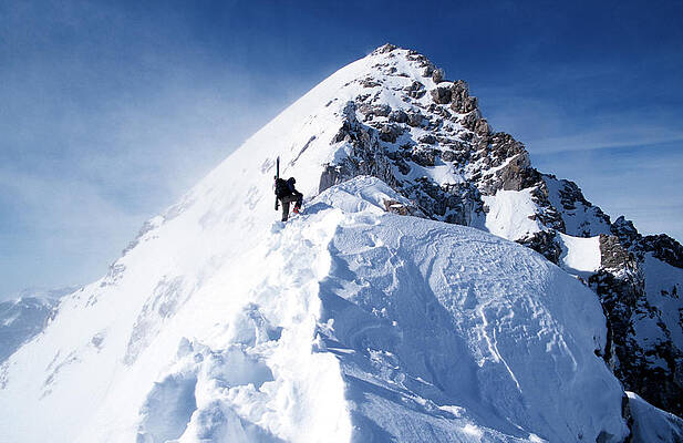 Wall Art - Photograph - Man Climbing Up Snowy Mountain by Corey Hendrickson