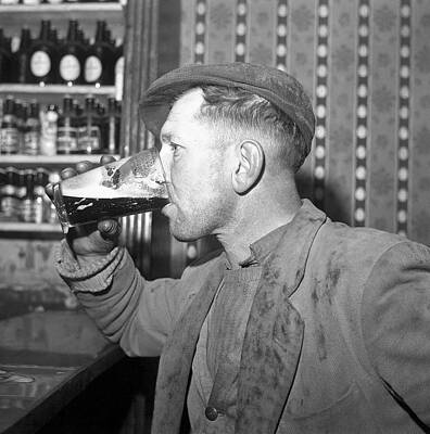 Man Drinking Pint of Stout by Irish Photo Archive