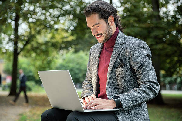 Wall Art - Photograph - Man In Blazer Using Laptop In Park by Tamboly Photodesign