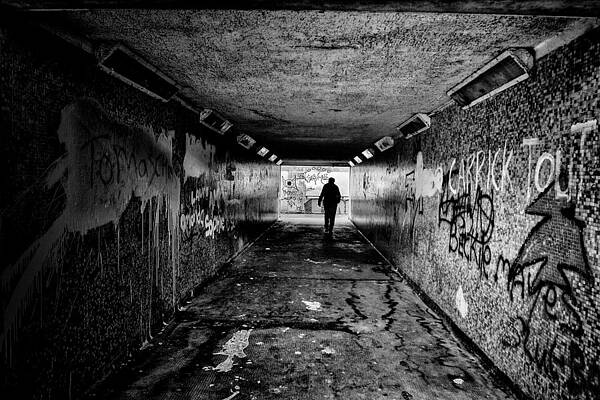 Wall Art - Photograph - Man in Subway by Nigel R Bell