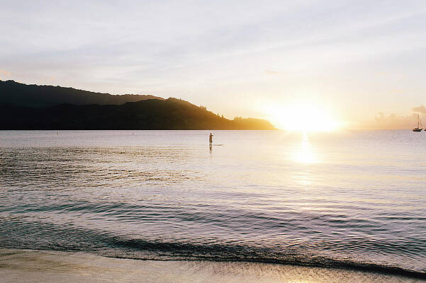 Wall Art - Photograph - Man Paddle Boarding During Sunset by Ryan Tuttle