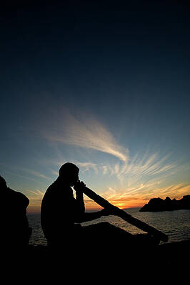 Wall Art - Photograph - Man Playing Didjeridu On A Beach by Bernardo Gimenez