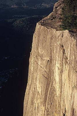 Wall Art - Photograph - Man Rides Unicycle On Cliff Edge by Rich Wheater