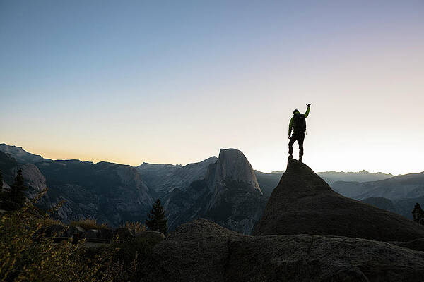 Wall Art - Photograph - Man Standing On A Rock With Half Dome by Paolo Sartori