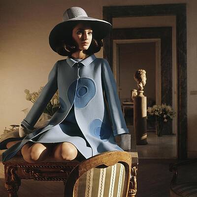 Wall Art - Photograph - Model Sitting On A Desk Wearing A Double-faced by Henry Clarke