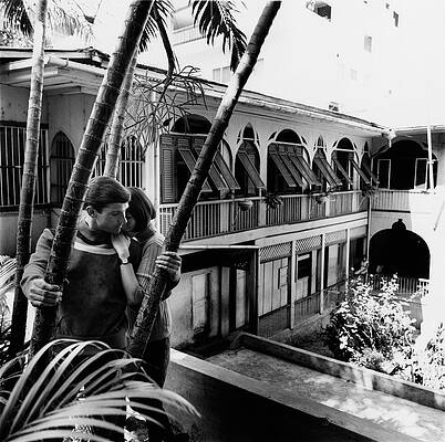 Wall Art - Photograph - Models Posing On The Balcony Of A Building by Leonard Nones