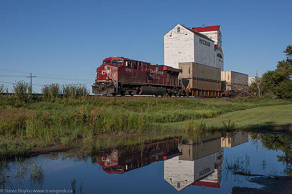 Train Reflection at Mortlach Saskatchewan Grain Elevator by Steve Boyko