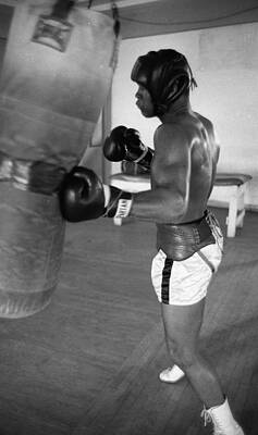 Wall Art - Photograph - Ali Punching Bag by Retro Images Archive