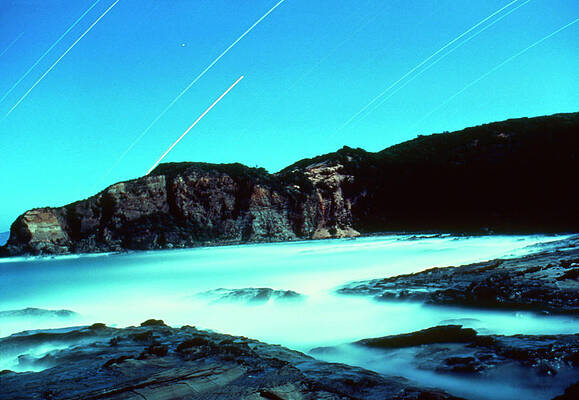 Wall Art - Photograph - Night View Of Dinosaur Cove With Startrails by Science Photo Library