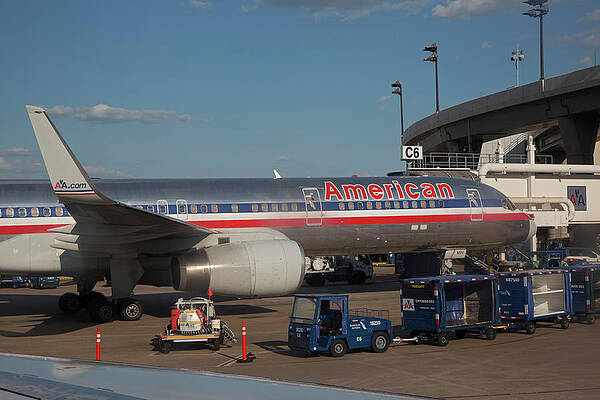 Wall Art - Photograph - Passenger Airliner At An Airport by Science Photo Library