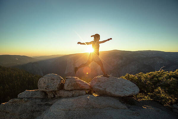 Wall Art - Photograph - Person Leaping Along Rocks At Sunset by Matt Andrew