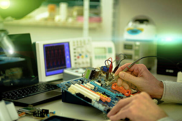 Wall Art - Photograph - Person Working In A Computer Lab by Science Photo Library