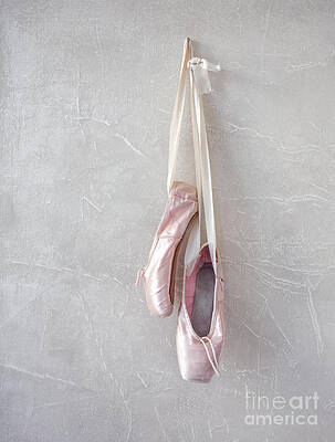 Pink ballet pointe shoes hanging on window Stock Photo by Prostock-studio