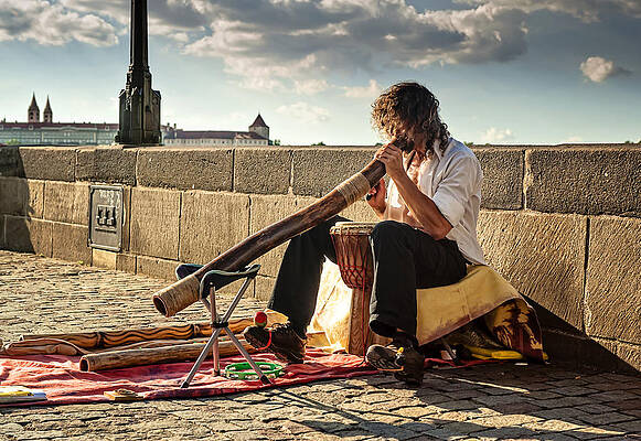 Wall Art - Photograph - Playing Didgeridoo on the Charles Bridge. Prague by Jenny Rainbow