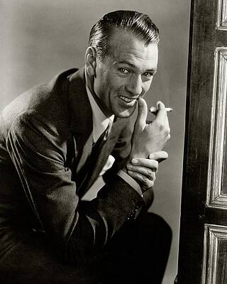 Wall Art - Photograph - Portrait Of Gary Cooper Holding A Cigarette by Lusha Nelson
