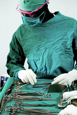 Wall Art - Photograph - Preparing Instruments For Surgery by Science Photo Library