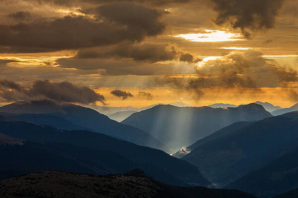 Ray of light in mountain by Dan Mirica