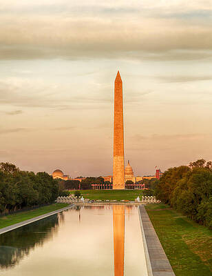 Wall Art - Photograph - Setting sun on Washington monument reflecting by Steven Heap