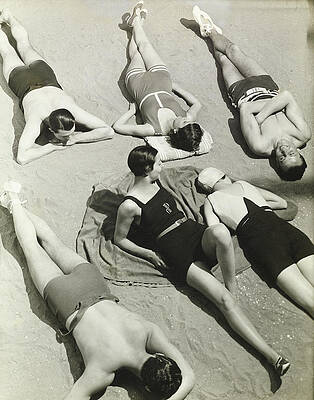 Wall Art - Photograph - Simone Demaria And Models Sunbathing On A Beach by George Hoyningen-Huene