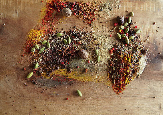Wall Art - Photograph - Spices Piled On Wood Surface by Maren Caruso