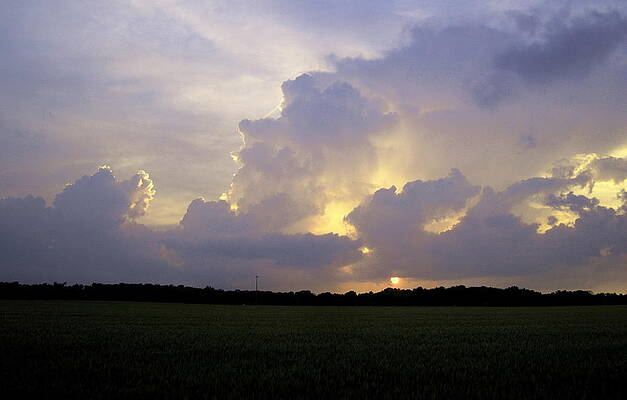Storm clouds and sunset. by John Fehrmann