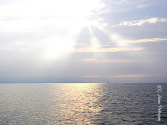 Sun Rays through Clouds  by Karen Adams