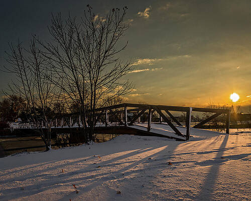 Wall Art - Photograph - Sunrise over a snow covered bridge by Chris Bordeleau