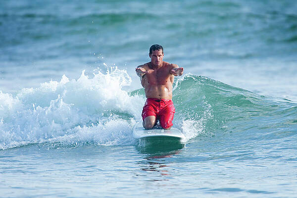 Wall Art - Photograph - Surfer On Knees While Riding Longboard by Joe McBride