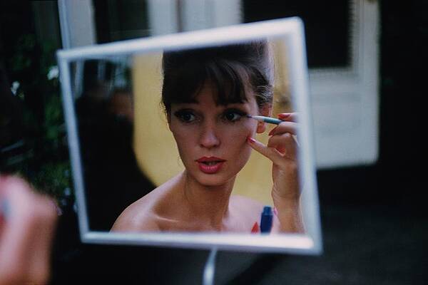 Wall Art - Photograph - The Reflection Of A Model Applying Make-up by Karen Radkai