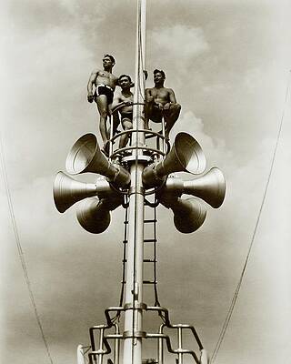 Wall Art - Photograph - The Spence Brothers Sitting At The Top Of A Tower by Lusha Nelson